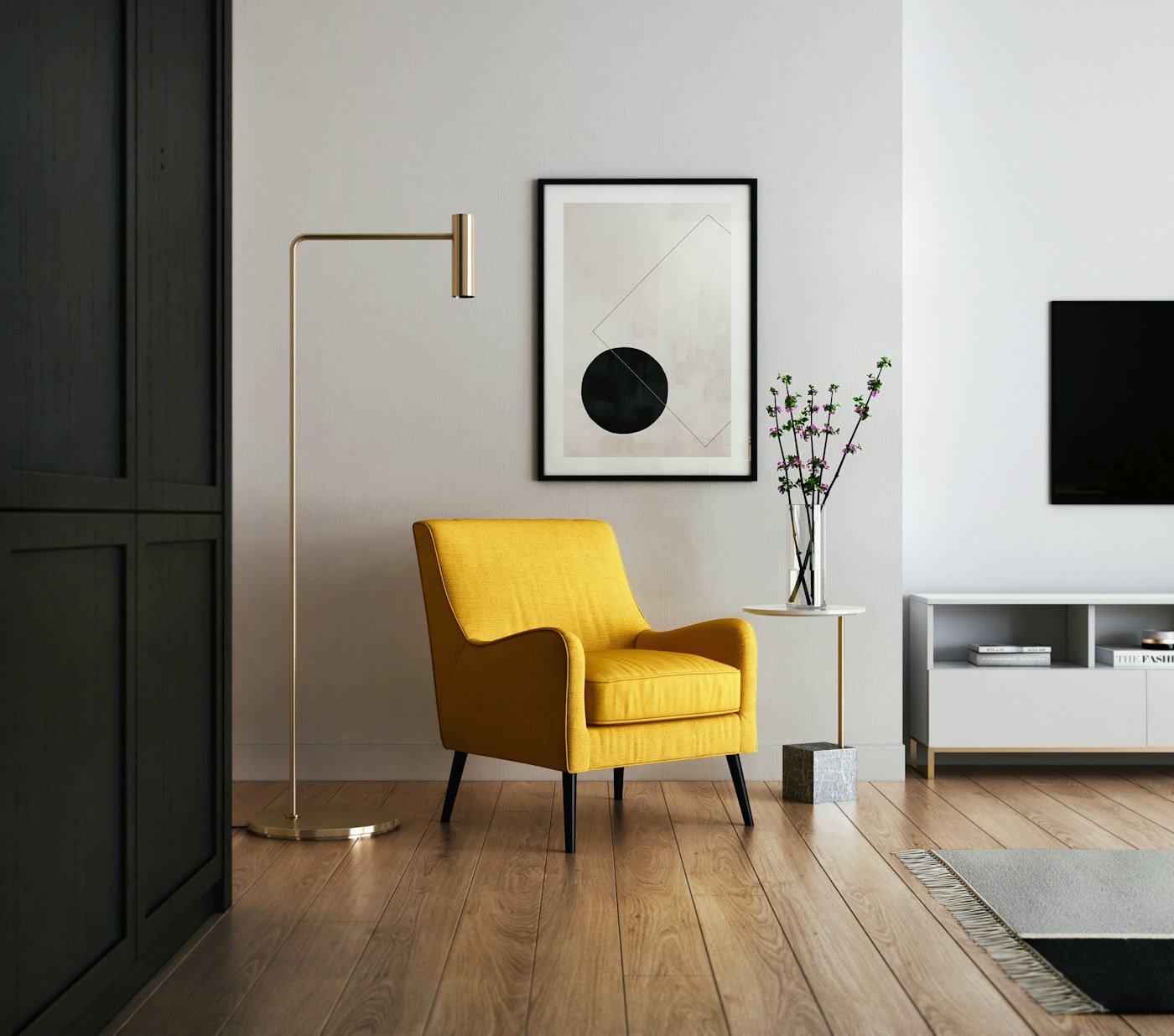 A person using a cordless vacuum in a bright compact living room