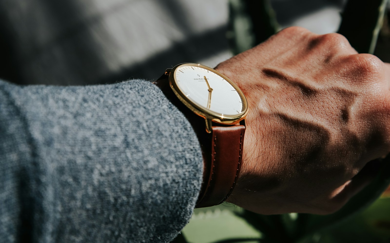 A person reviewing notification and privacy settings on a smartwatch and phone